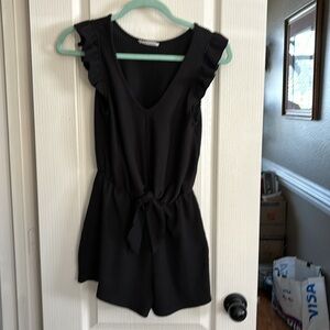 Caution‎ to the wind, black ribbed romper. In like new condition. Super cute.